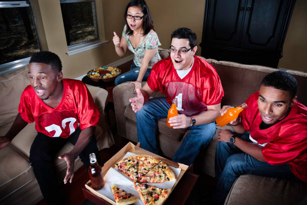 istock Friends Watching Football on TV 166041530