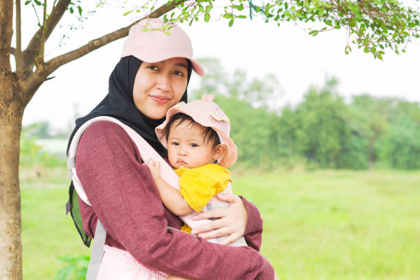 Portrait of Mother and Daughter under a Tree