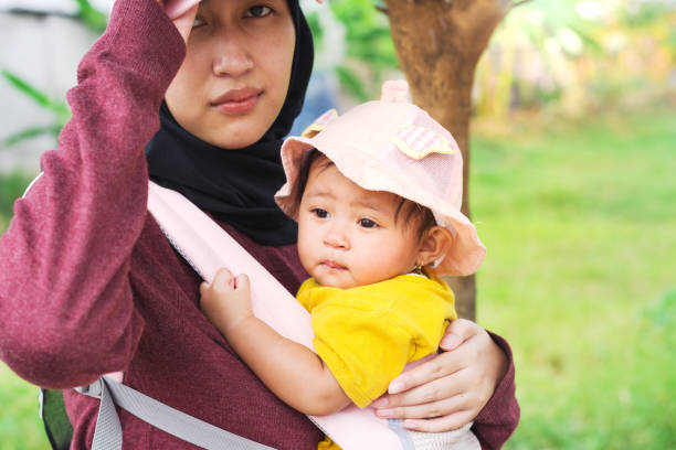 istock Tired Baby After Playing Outside with Her Mother 1660438453