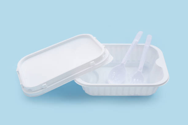 istock Plastic food boxes with spoon and fork on blue background. 1660449605
