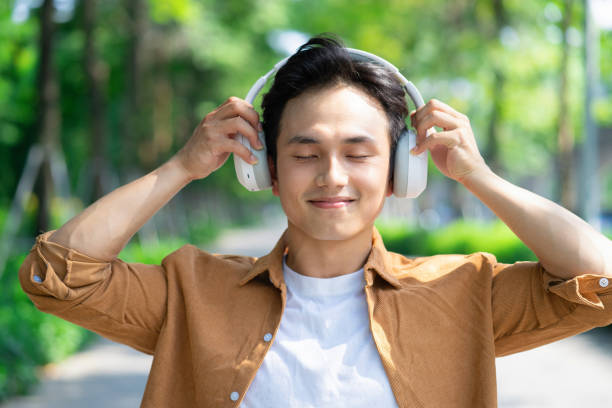istock Portrait of young Asian man outside 1660480764