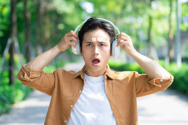 istock Portrait of young Asian man outside 1660481005