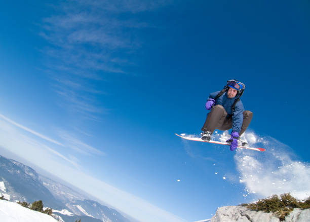 istock Snowboarder in Acrobatic Jump 166048153