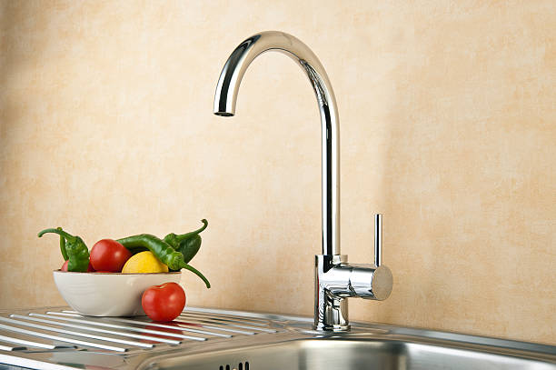 istock Stainless Kitchen sink, Faucet And vegetables 166048382