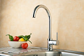 Stainless Kitchen sink, Faucet And vegetables