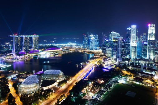 singapore. 14 th april, 2023: views of  marina bay by night, that is the most remarkable landmark of the city in singapore. it is surrounded by an avantgarde skyline and the famous marina bay sands building.