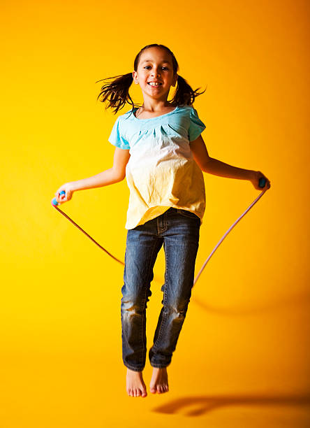 istock Cute Little Girl Jump Roping 166049305
