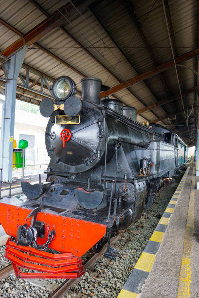 istock Old steam train departs from a railway station. 1660512652