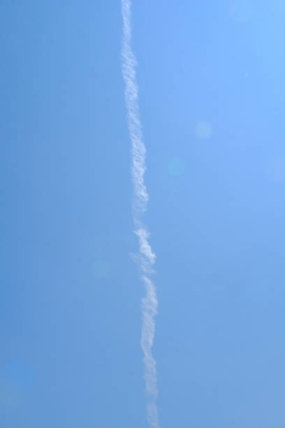 istock Jet plane smoke streaking the sky 1660531879