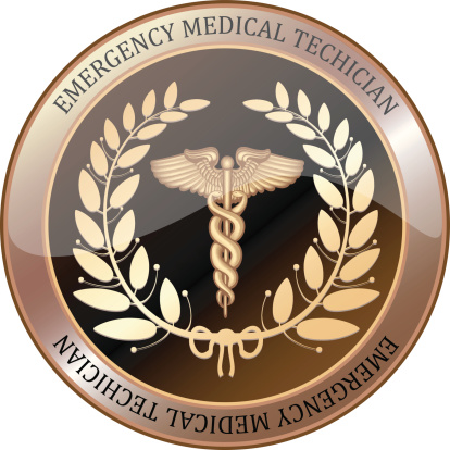 EMT golden shield with a laurel wreath and caduceus.