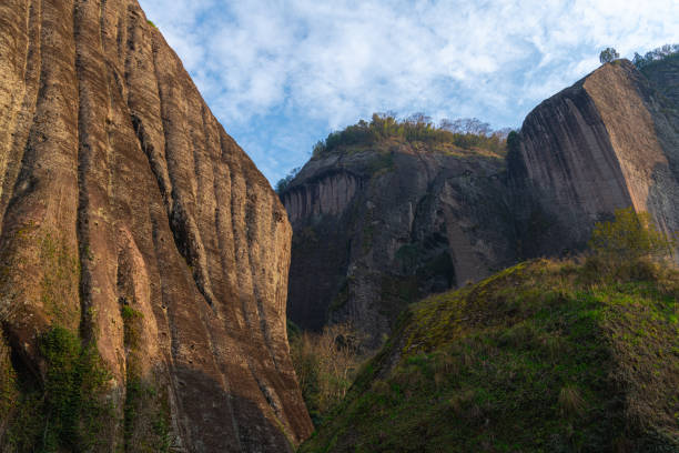 istock Close up on Rock formations lining the nine bend river or Jiuxi in Wuyishan 1660541950