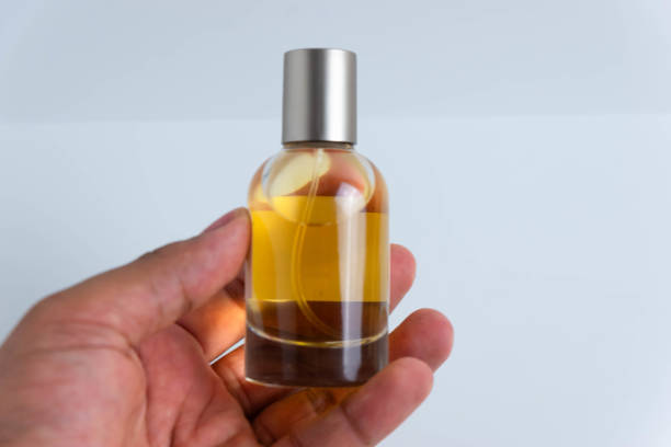 istock A small bottle of perfume being held. 1660554869
