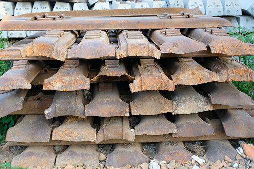 Texture and Background Photography. Photo of a pile of railroad sleepers. Railway sleepers and steel, stacked and placed on the side of the road. Bandung - Indonesia