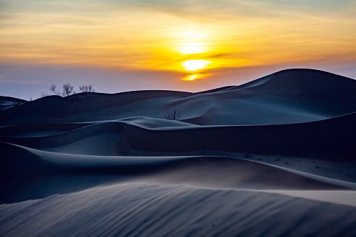 Sunset and beautiful dune lines in Kubuqi Desert, Inner Mongolia, western China