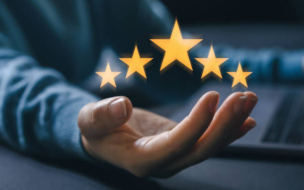 istock Customer service and satisfaction, five star, customer, hand of customer or client holding the stars to complete five stars, Quality assurance, give satisfaction in service. rating very impressed 1660570286