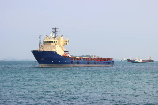 Singapore City - March 25, 2023 - Cargo ships sail in the waters around Singapore. This city-state is one of the port centers in the Southeast Asia region.