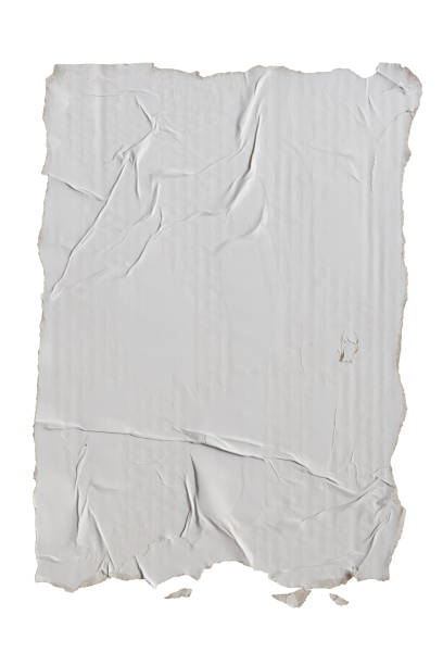 Torn A4 paper glued on a cardboard Torn A4 paper glued on a cardboard on white background with clipping path wild posting ad stock pictures, royalty-free photos & images