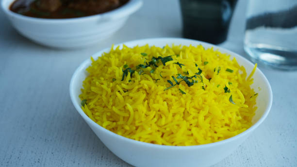 istock Aromatic long grain Basmati rice with safron on a white bowl. 1660614689