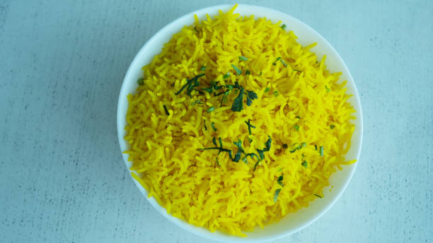 istock Aromatic long grain Basmati rice with safron on a white bowl. 1660614740