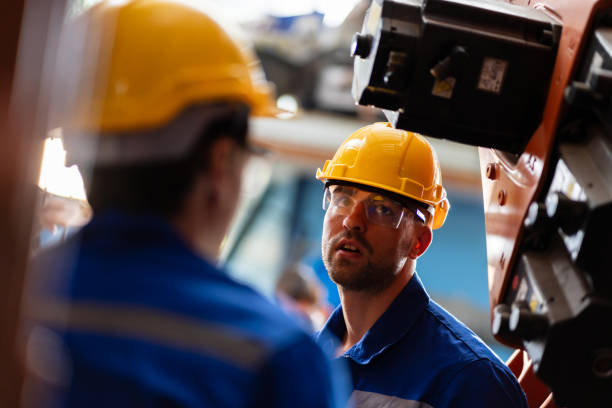istock A team of engineers meeting to inspect computer-controlled steel welding robots 1660631703