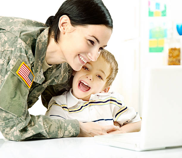 istock Female American Soldier with Son 166064123