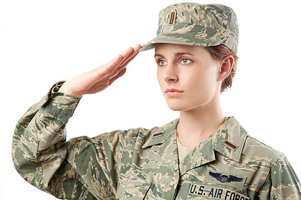 US Air Force Series: American Airwoman US Air Force Airwoman in airman battle uniform or ABU. air force salute stock pictures, royalty-free photos & images