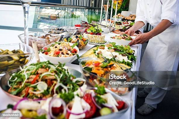 Waiter Serving A Buffet Table Stock Photo - Download Image Now - Food And Drink Industry, Buffet, Food