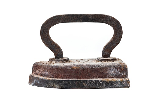 An old, rusty iron with a green handle and levers