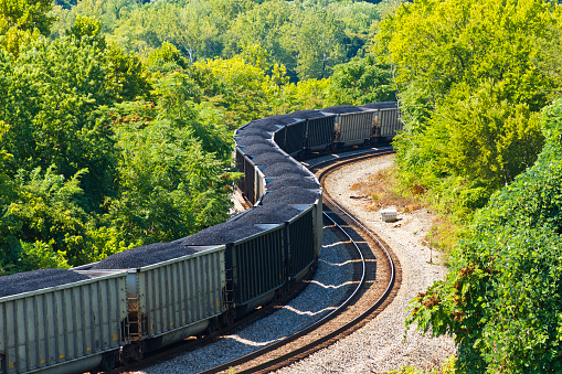 Aerial view of rail cars filled with coal in a train yard