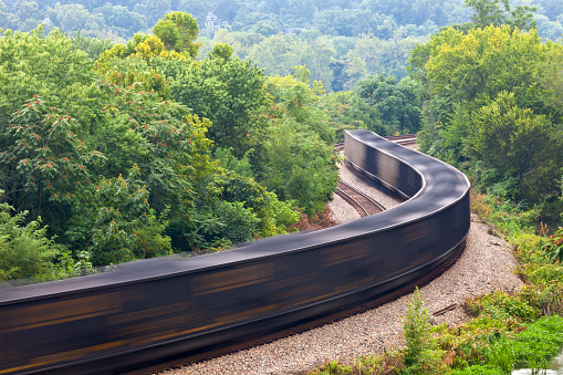 A Coal Train Finishing It's Journey Through The Woods