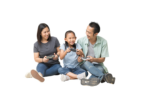 Happy asian family of father, mother and daughter play game joystick on siting on floor, full body isolated on background, Clipping Paths for design work
