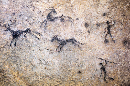 faked cave paintings on a sandstone wall in saxon switzerland, elbsandsteingebirge