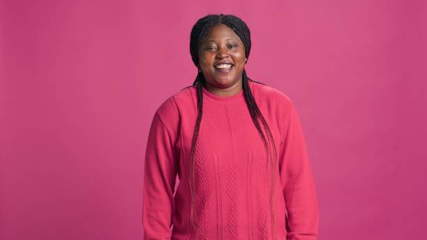 istock Lady in pink outfit laughing for camera 1660723393