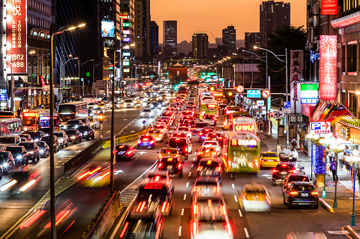 Taipei, Taiwan- September 21, 2022: metropolis Building view of the Zhongxiao West Road near Taipei Main Station in Taiwan, This is the time when the traffic is heavy.