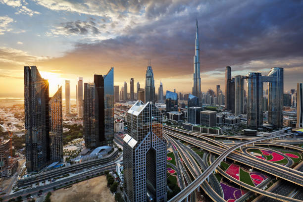 istock Fantastic rooftop view of Dubai's modern architecture by night with illuminated skyscrapers, UAE 1660733809
