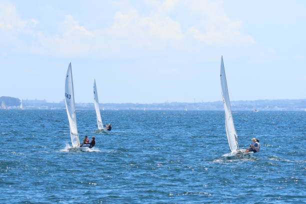 A view of the dinghy regatta off the coast of Enoshima. Racing scenery of snipe class boats.