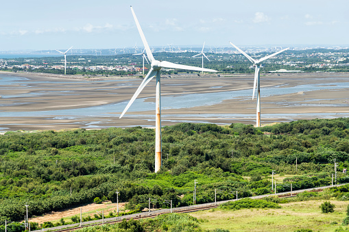 Miaoli, Taiwan- July 13, 2022: Wind power at Houlong Cape of Good Hope Scenic Area in Miaoli, Taiwan.
