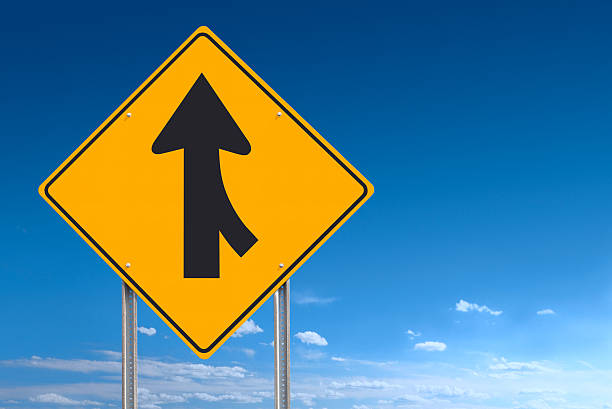 istock Merge Converge Ahead Road Sign Post Over Blue Sky Background 166076381