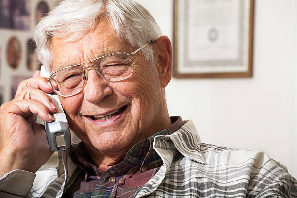 istock happy senior man talking on telephone 166076668