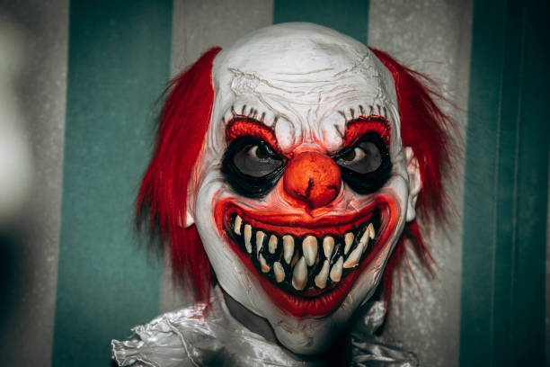 istock redhead clown staring at the observer in the circus 1660772187
