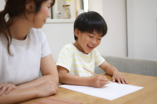 istock Parent and child drawing a picture diary 1660774822