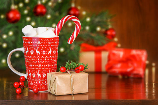 istock Christmas presents and cup of hot chocolate 1660800363