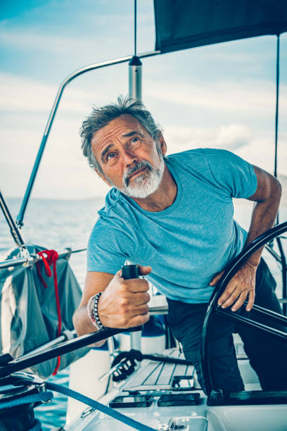 istock Skipper sailing on sailboat 1660806359