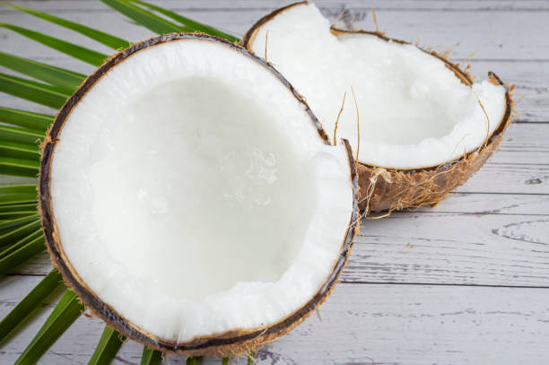 istock Brown coconut, cut in half, white flesh 1660809047