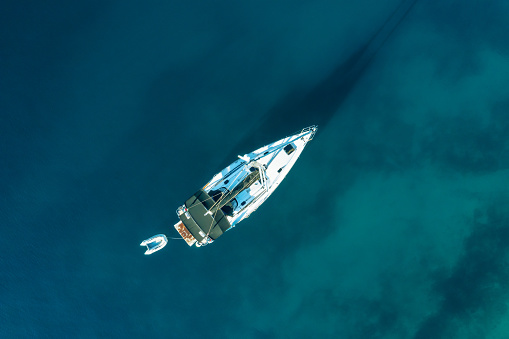 Anchored sailboat, High angle view photo from drone.