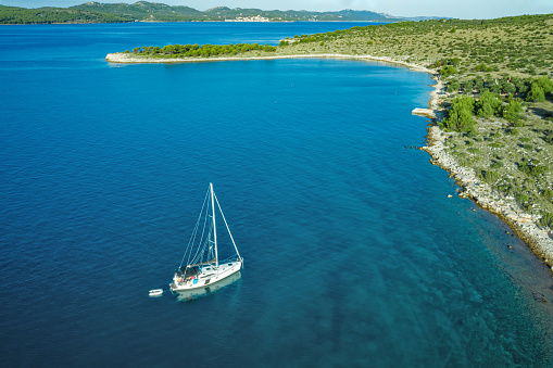 Anchored sailboat, High angle view photo from drone.