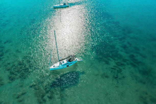 istock Anchored sailboat, view from drone 1660810651