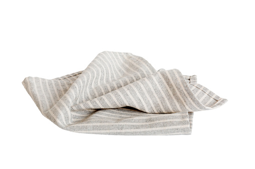 Grey textile napkin isolated on white background. Folded decorative kitchen cotton towel. Top view.