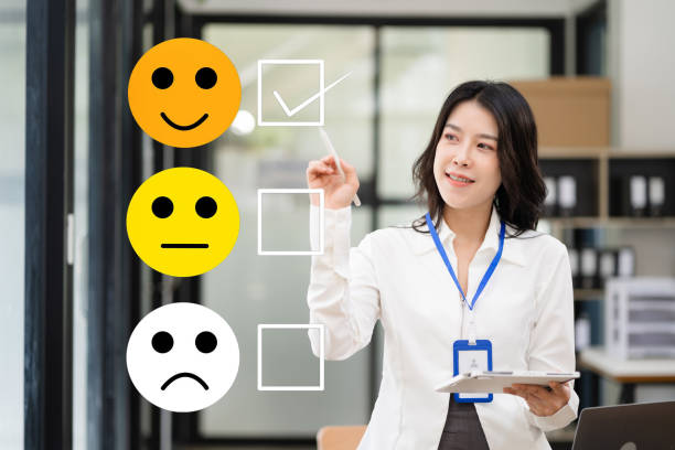 istock Woman holding a digital tablet with checkboxes rating smiley faces excellent for Satisfaction Survey, Happy Client Customer Experience concept. 1660835046