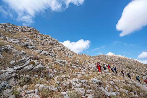Alabelen Mountain, Antalya, Turkey-September 3, 2023: people hiking with the scenic view of Feslikan Plateau and Alaben Mountain, Antalya, Turkey